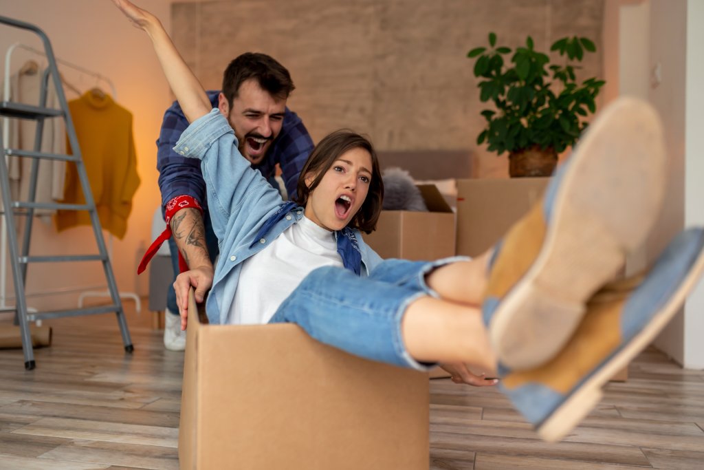 family celebrating successful move-in day at new home - professional movers state to state